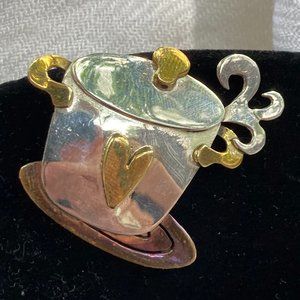 Steaming cooking pot of mixed metals pin